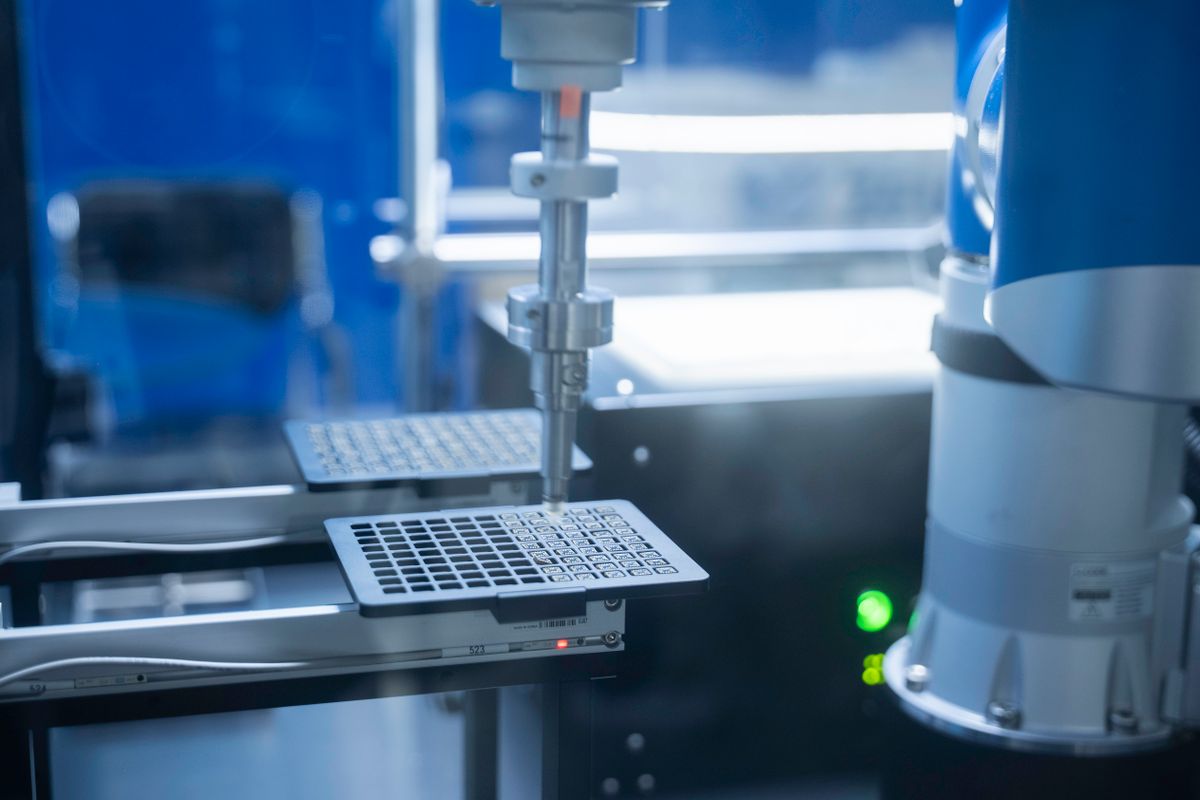 Robotic arm running an automated process in a laboratory