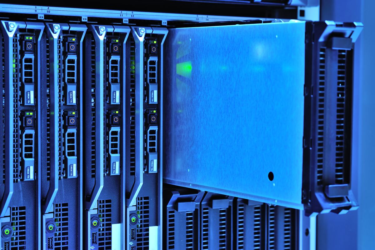 Illuminated server racks in a data centre aisle