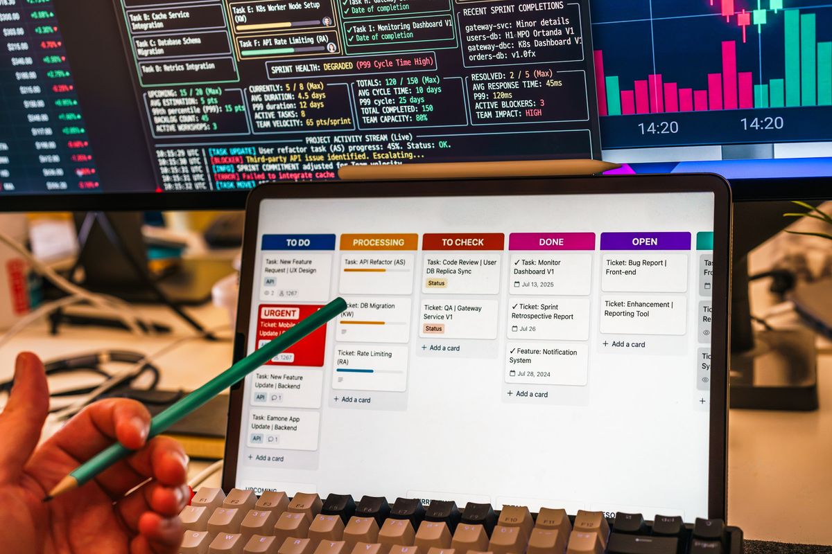 Tablet and screens showing a connected business workflow