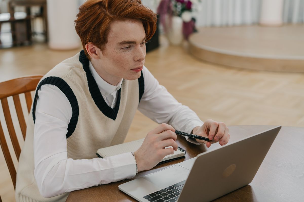 Student working through an online course on a laptop