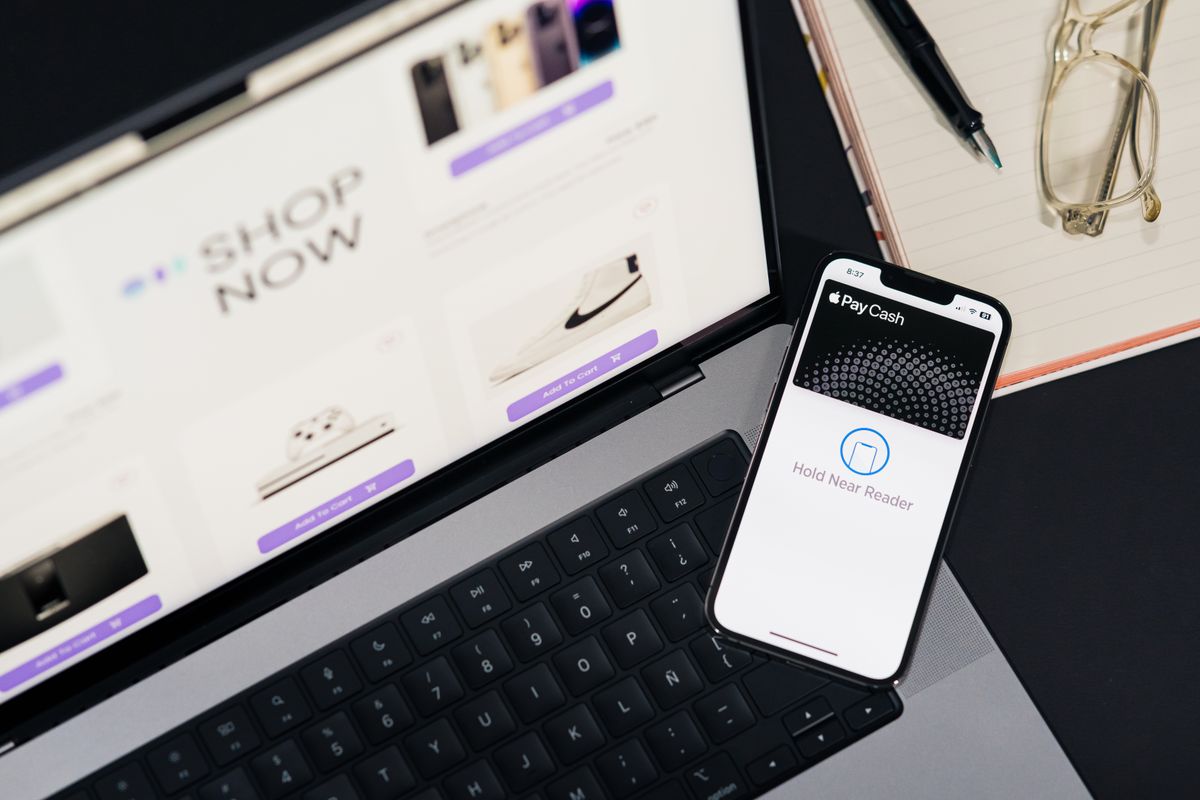 Laptop and phone open on an online storefront
